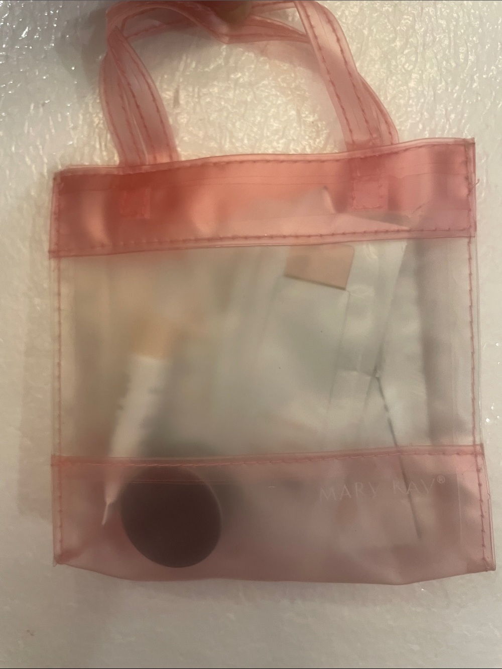 Vintage Mary Kay pink cosmetic bag with skincare samples set
